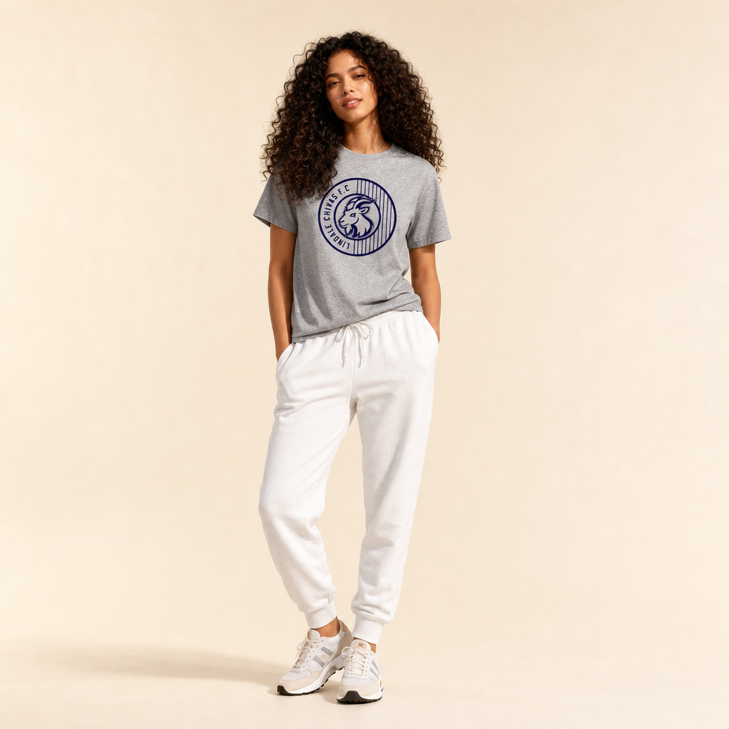 Woman wearing the Lindale Chivas Soccer Logo Tee in Premium Heather with joggers and running shoes