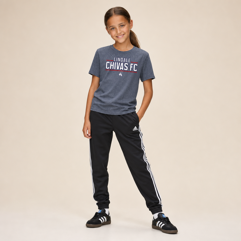 Girl wearing the Lindale Chivas Wordmark Youth Tee in Athletic Grey Triblend with Adidas soccer pants and Sambas