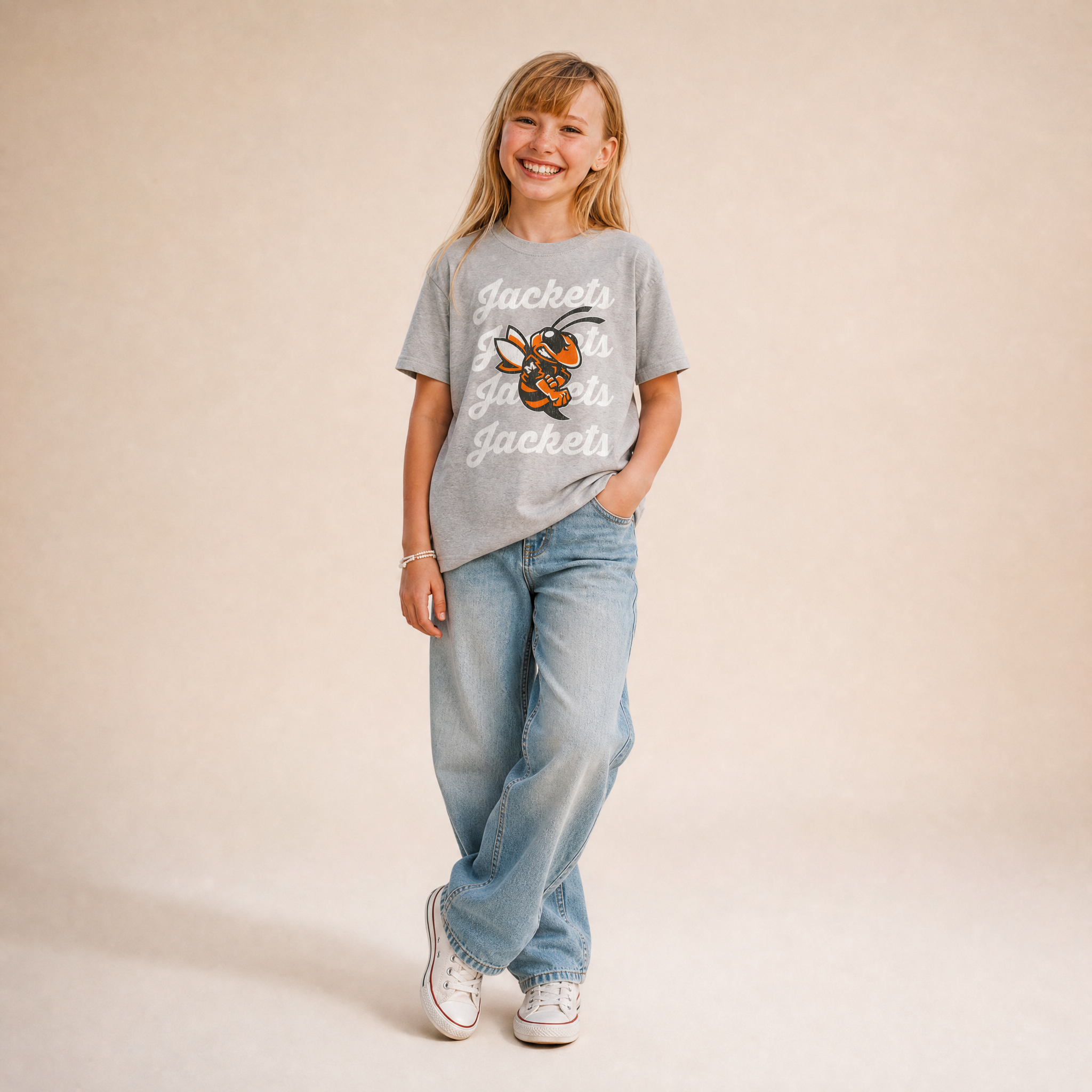 Mineola Buzz Tee Youth in Heather Grey — Mineola Jackets Buzz logo, front view