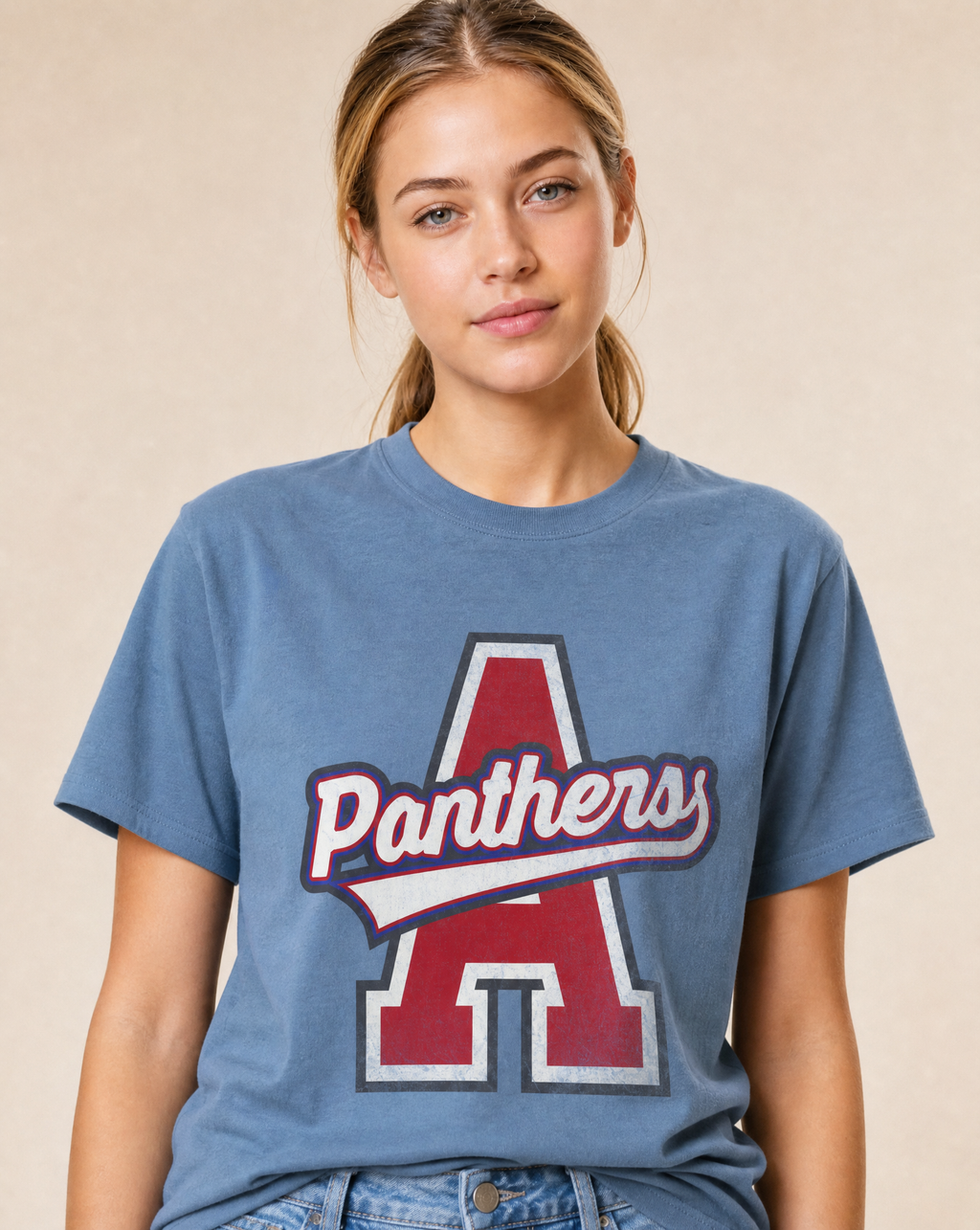 Close-up of the Alba-Golden Panthers varsity print in Washed Denim