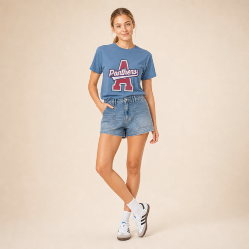 Model wearing the Alba-Golden Panthers Varsity Spirit Tee in Washed Denim by Dane Apparel