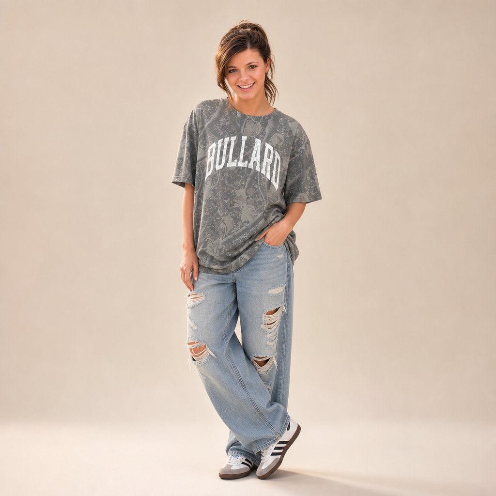 Bullard Premium Camo Tee — BULLARD in a white varsity arch on grey Deadwood Tree Camo, worn by a model