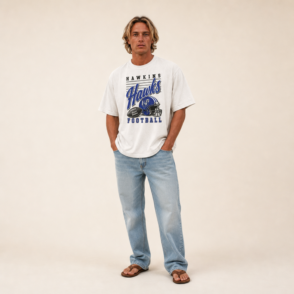 Hawkins Hawks Football Retro Tee worn untucked with jeans