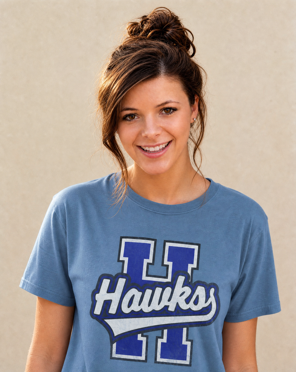 Close-up of the Hawkins Hawks varsity print in Washed Denim
