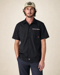Vanguard Autotech crest Dickies shop shirt in black on male model, front view