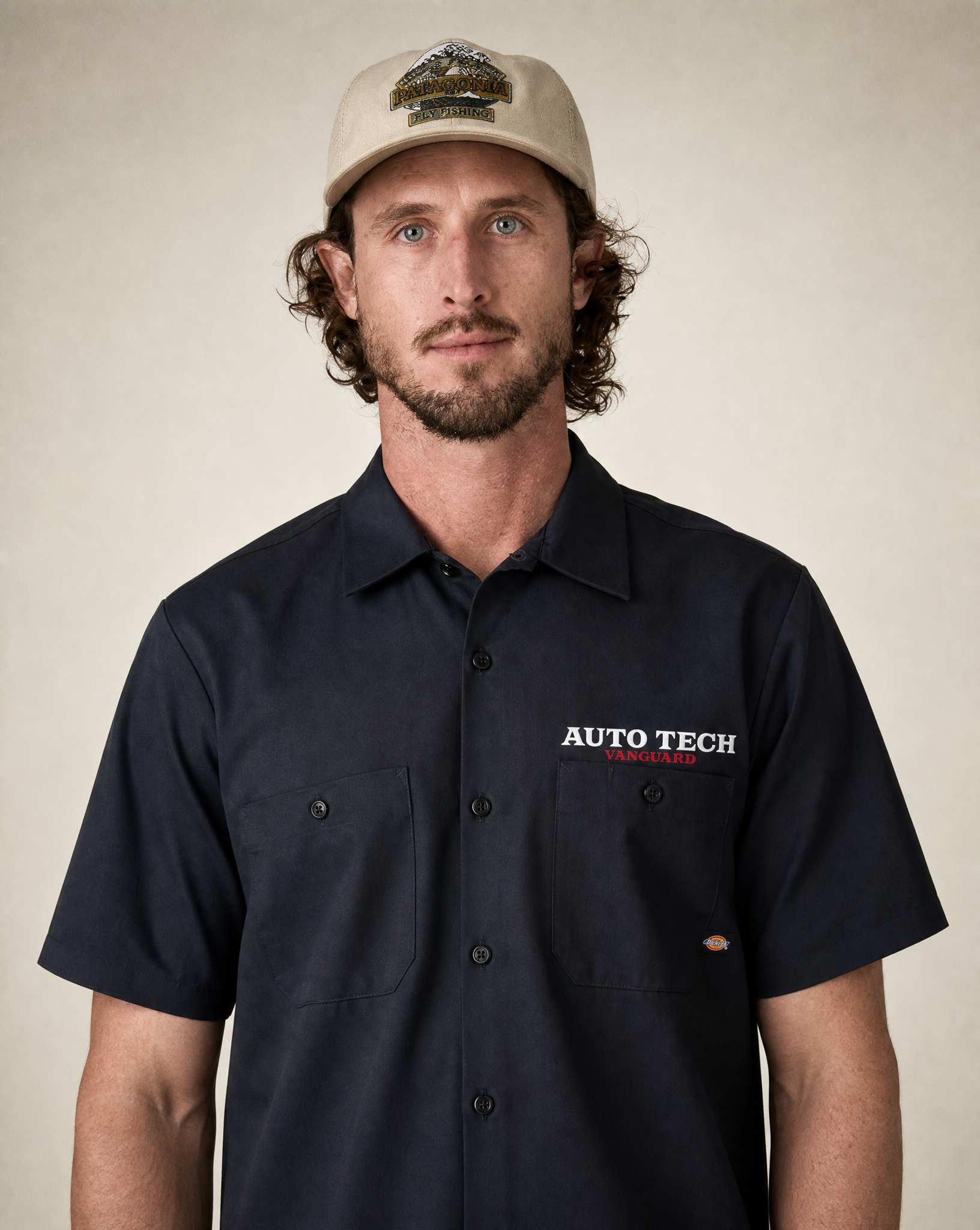 Vanguard Autotech chest logo close-up on black Dickies work shirt
