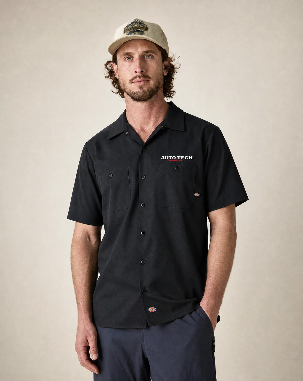 Vanguard Autotech text logo Dickies shop shirt in black on male model, front view