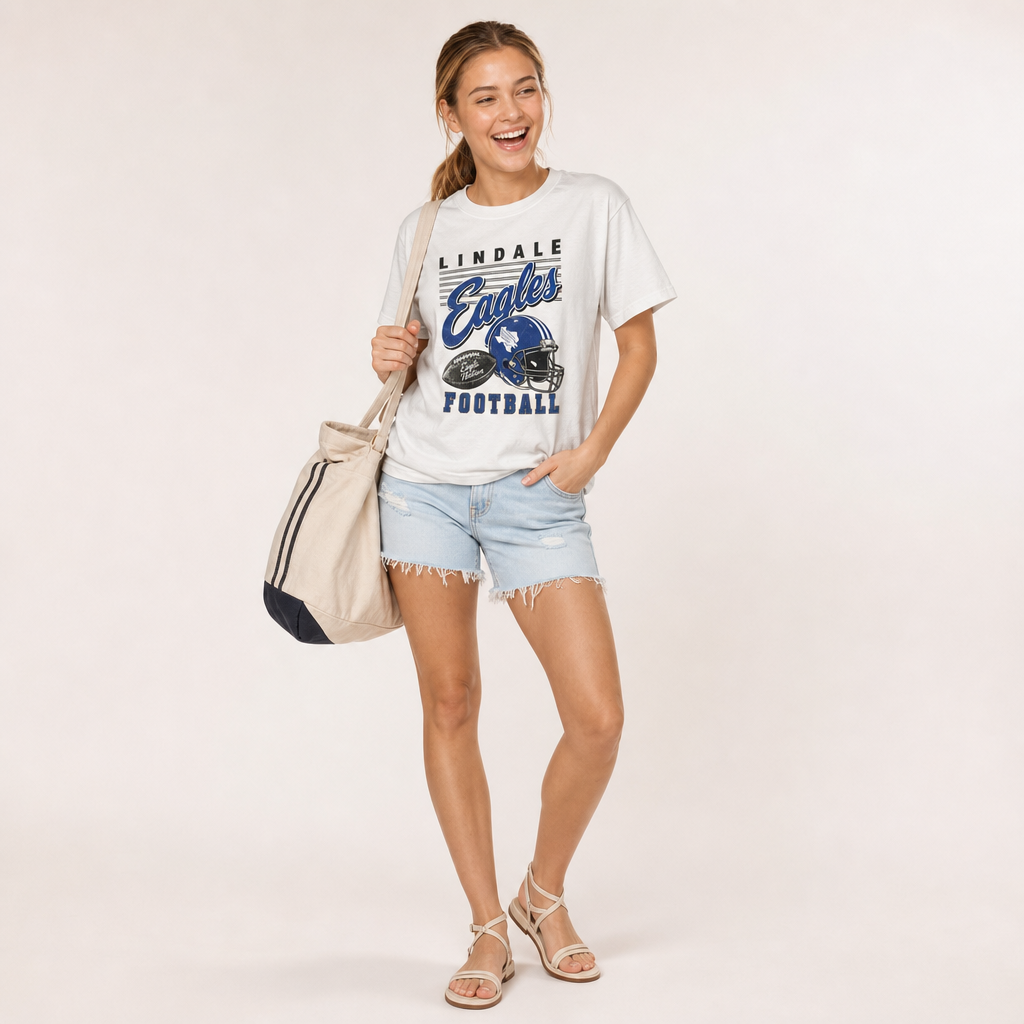 Lindale Eagles Football Retro Tee in ivory — vintage helmet and Eagles script graphic in blue, worn by a model