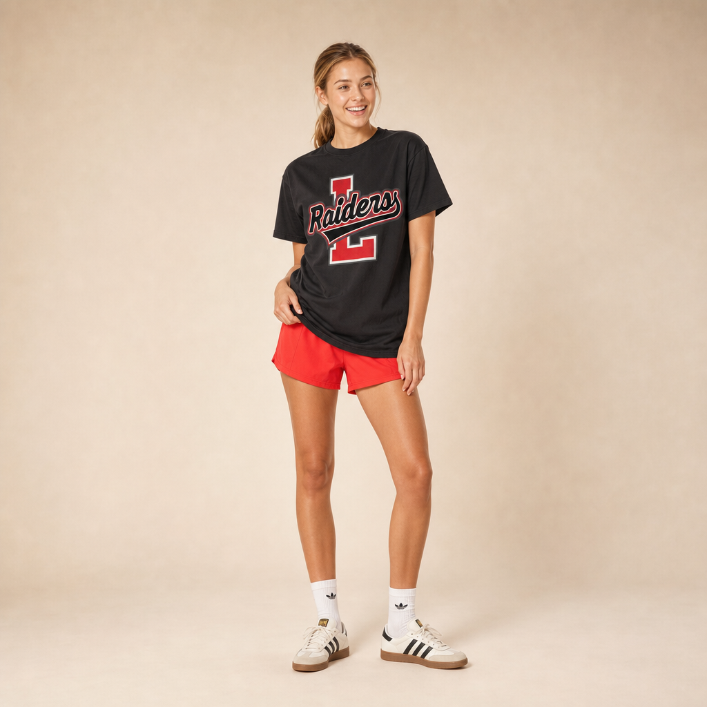 Model wearing the Tyler Legacy Raiders Varsity Spirit Tee in Black by Dane Apparel