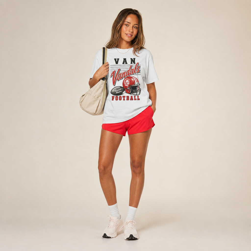 Van Vandals Football Retro Tee — vintage helmet and Vandals script graphic in red, worn by a model