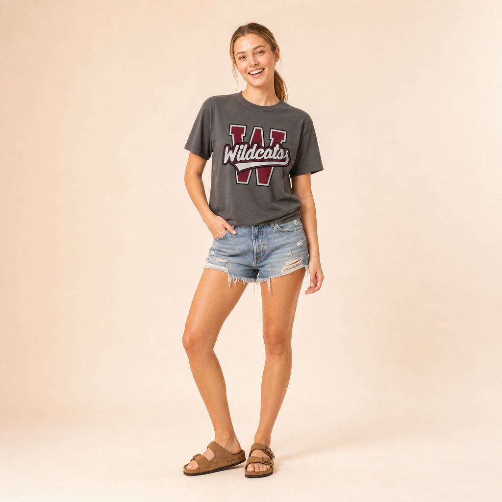 Model wearing the Whitehouse Wildcats Varsity Spirit Tee in Pepper by Dane Apparel