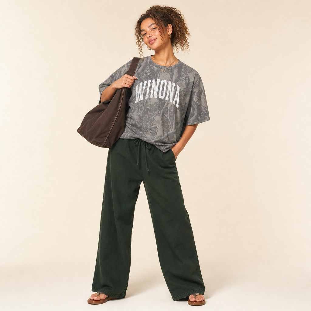 Winona Premium Camo Tee — WINONA in a white varsity arch on grey Deadwood Tree Camo, worn by a model