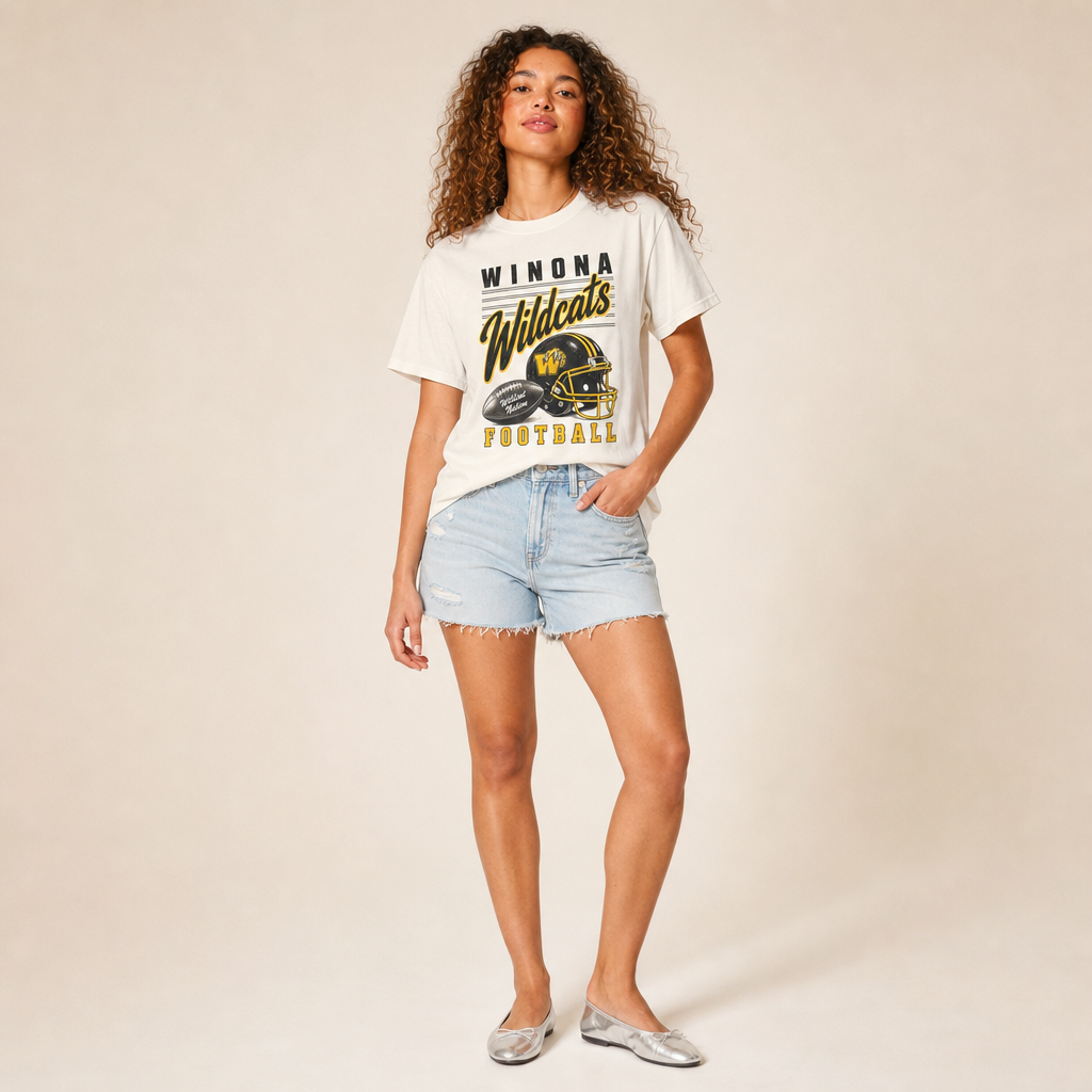 Winona Wildcats Football Retro Tee in ivory — vintage helmet and Wildcats script graphic in black and gold, worn by a model