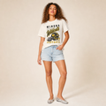 Winona Wildcats Football Retro Tee in ivory — vintage helmet and Wildcats script graphic in black and gold, worn by a model