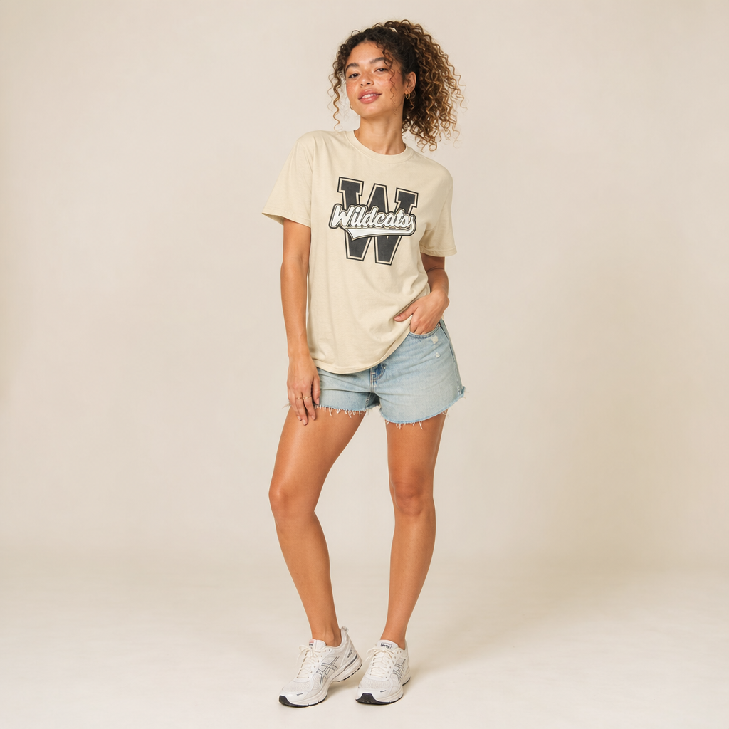 Model wearing the Winona Wildcats Varsity Spirit Tee in Butter by Dane Apparel